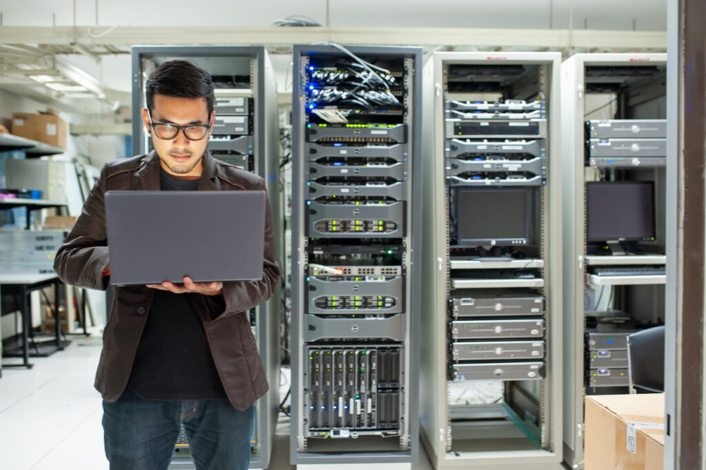 a man performing integrated systems testing for data centers